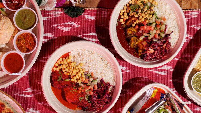 A table featuring an assortment of Indian inspired dishes