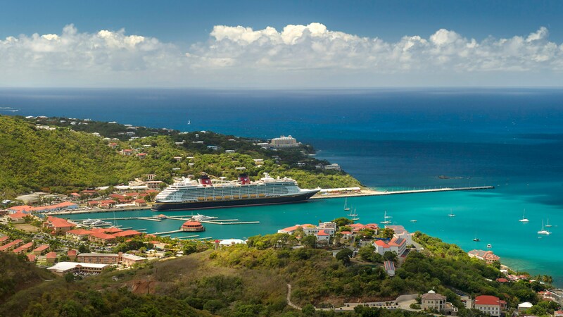 A Disney Cruise Line ship docked in a harbor at Saint Thomas in the US Virgin Islands