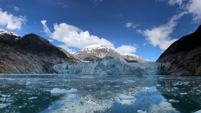 Ice covered cliffs along a fjord