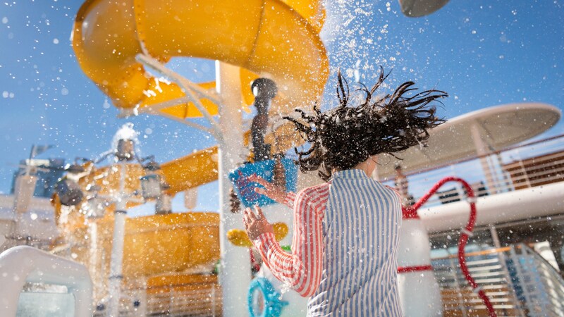 A young girl near a water slide