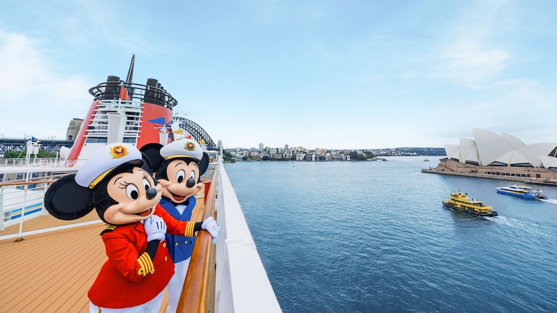 Captains Minnie and Mickey Mouse admiring the Sydney Opera House from the deck of a Disney Cruise Line ship