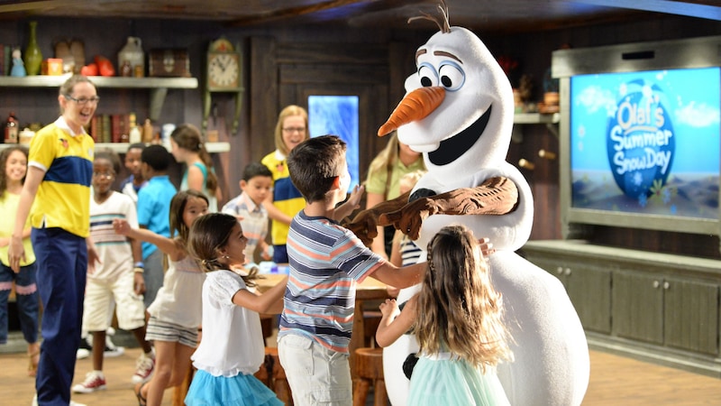 Children hugging Olaf in the Disney Oceaneer Club aboard the Disney Magic cruise ship