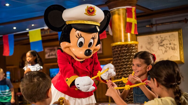 Captain Mickey Mouse showing kids how to tie a knot in a rope 