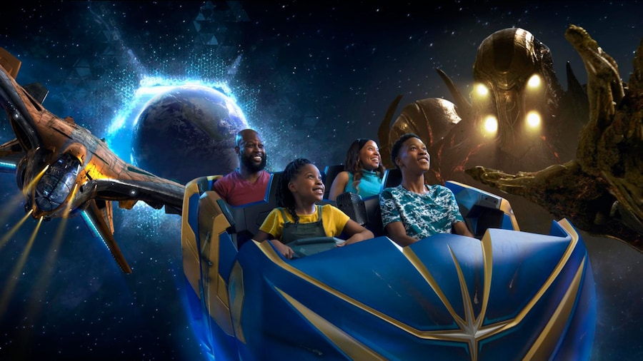 A family rides in a space vehicle while a spaceship and out of this world creature follows them.