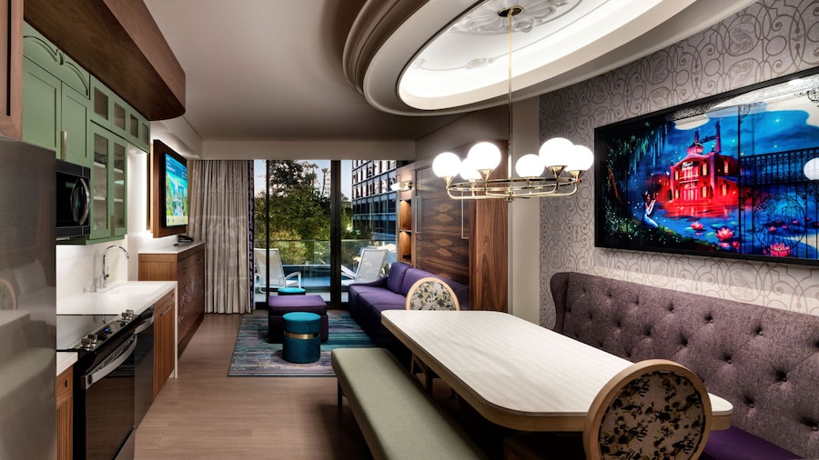 An artist rendering of a room with 2 beds, a long dresser, a large window and themed artwork on the walls