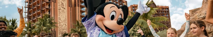 Mickey Mouse dancing with a group of children next to one of the pools at Aulani, A Disney Resort & Spa