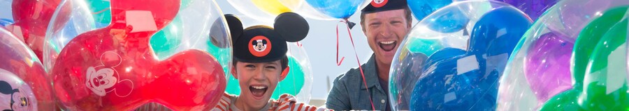 Family celebrating, Disney balloons