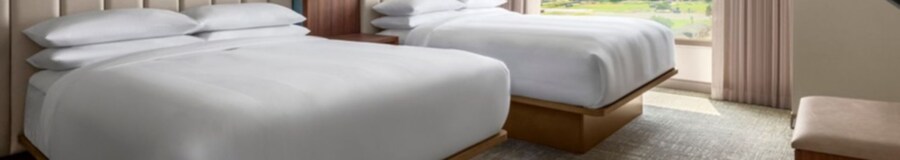 A Family Suite at Anaheim Marriott Suites featuring a bedroom with 2 queen beds and a large window