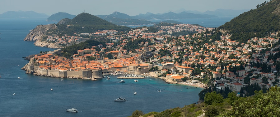 A historic stone fortification surrounding the coastal town of Dubrovnik A historic stone fortification surrounding the coastal town of Dubrovnik