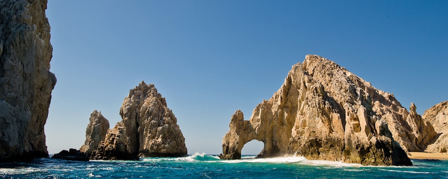 Giant, jagged boulders in the ocean form their own tiny islands Giant, jagged boulders in the ocean form their own tiny islands