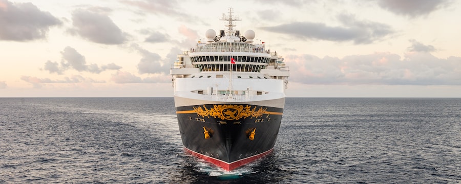 A Disney Cruise Line ship sails in the open ocean A Disney Cruise Line ship sails in the open ocean