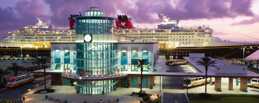 A Disney Cruise Line building in front of a Disney Cruise ship passing through the Panama Canal A Disney Cruise Line building in front of a Disney Cruise ship passing through the Panama Canal
