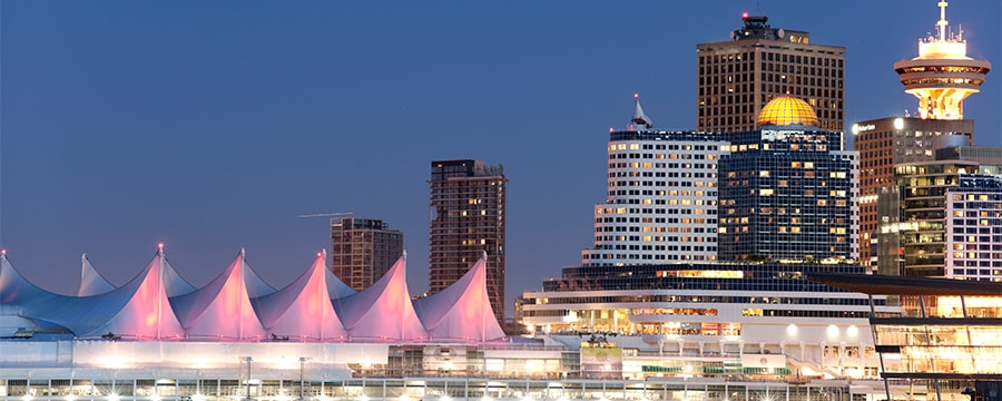 Vancouver Canada's convention center along the waterfront at night Vancouver Canada's convention center along the waterfront at night