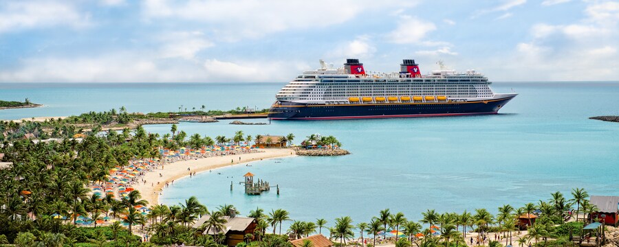 A Disney Cruise Line ship docked at a beach in Castaway Cay