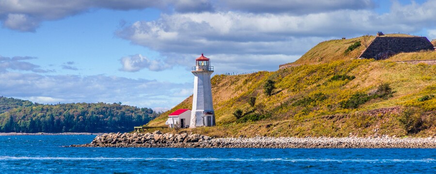 A lighthouse near the shoreline overlooking the ocean