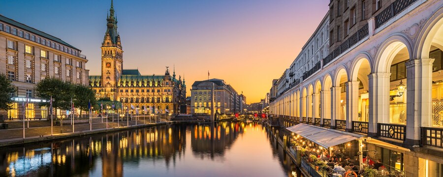 The harbor in Hamburg, Germany with waterfront buildings and cafes
