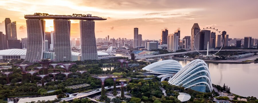 The Marina Bay Sands Singapore Hotel, Gardens by the Bay and the Singapore Flyer observation wheel at Marina Bay at sunset