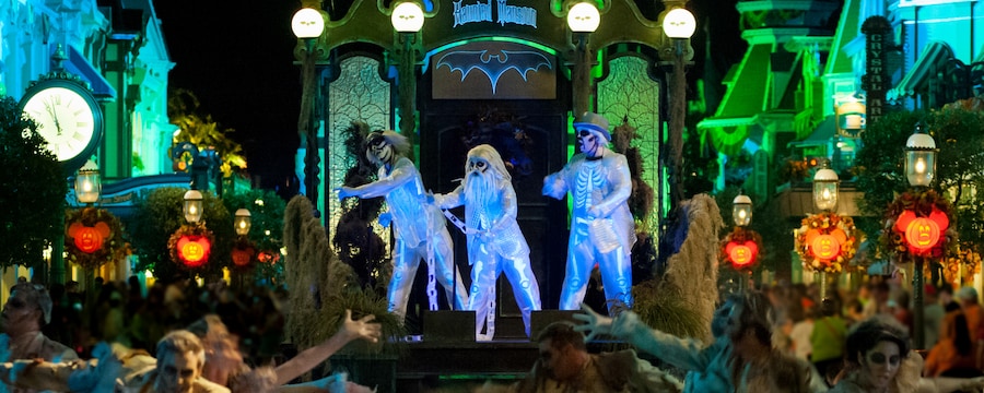 Performers dance on the Haunted Mansion float during the Boo to You Halloween Parade