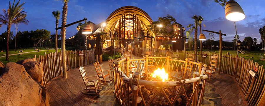 Wooden rocking chairs surrounding a firepit at Disney's Animal Kingdom Lodge  
