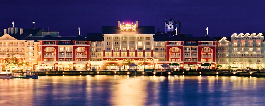 Disney’s BoardWalk area lit up at night as seen from Crescent Lake