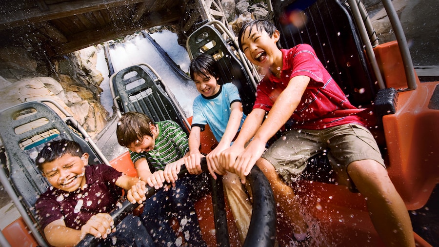 A group of kids ride Grizzly River Run

