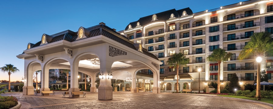 The illuminated exterior of Disney’s Riviera Resort