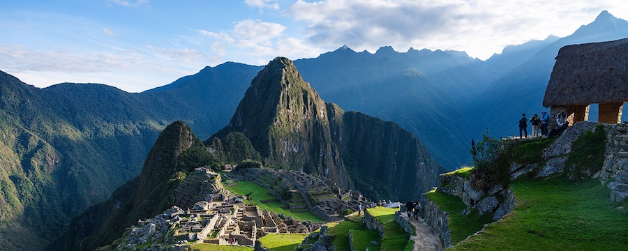 A group of tourists overlooking Machu Picchu.