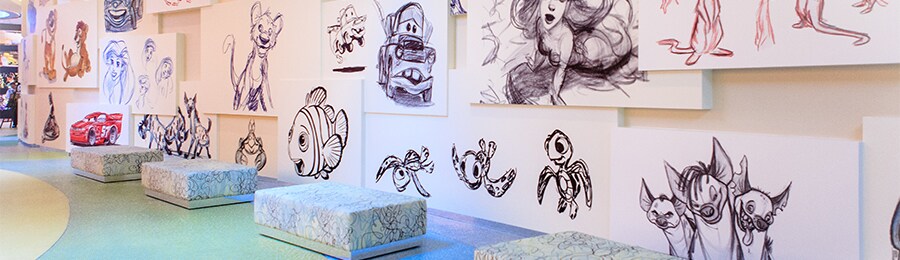 The lobby lounge at Disney's Art of Animation Resort, decorated with sketches of Disney characters