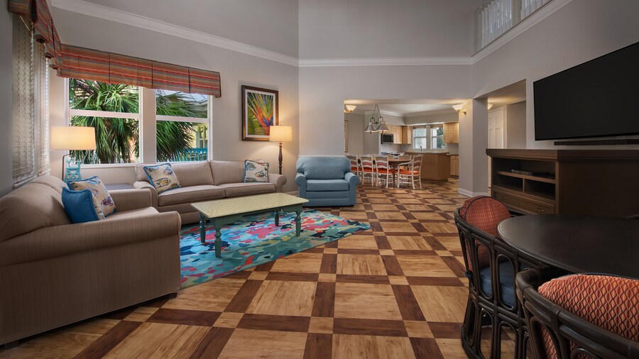 Living room with 2 couches, a coffee table and flat screen television 