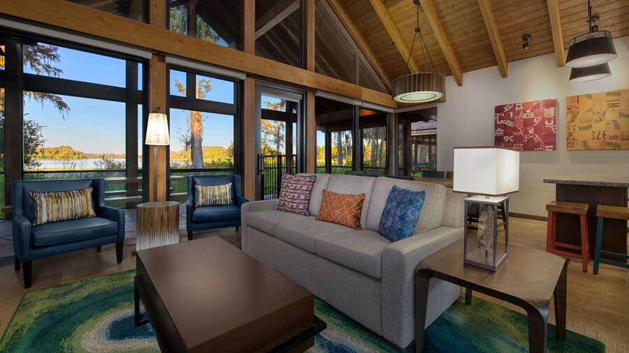 A large seating area with windows overlooking nature