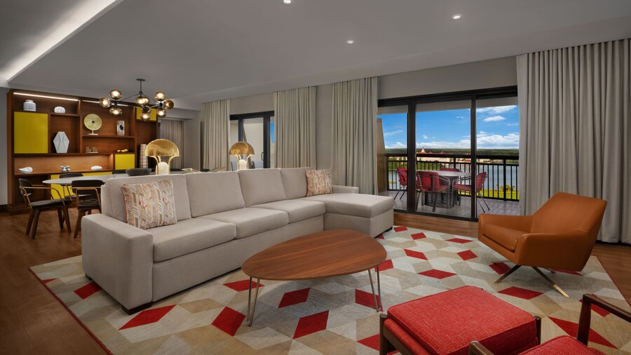 Living area with a sofa, easy chairs, and a round coffee table
