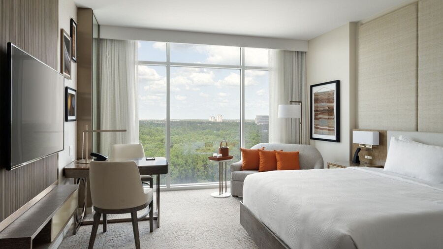 A hotel room with a large king sized bed