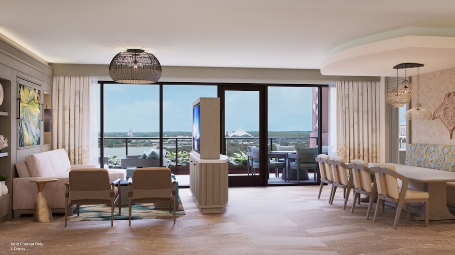 A hotel penthouse with a long dining table, a deck overlooking Magic Kingdom park, and a living area with a couch, chairs and a TV