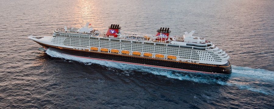 A Disney Cruise Ship sailing across open waters