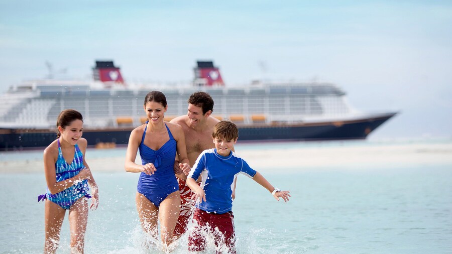 A Family Of 4 Float In The Ocean With Tropical Island And Disney Cruise Ship