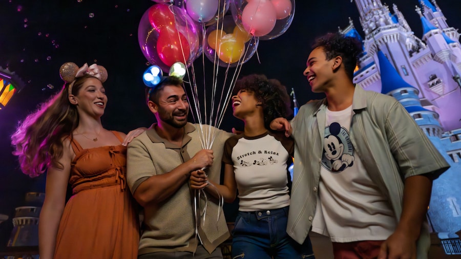 Walt Disney World theme park guests in the evening