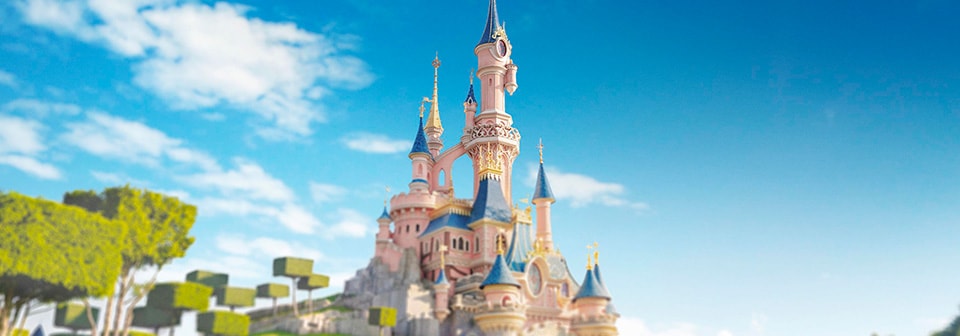 A digital rendition of Sleeping Beauty Castle surrounded by sculptured trees and manicured lawns 