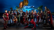 The Super Heroes of Avengers Campus pose in front of their headquarters, including Iron Man, Spider Man and many others