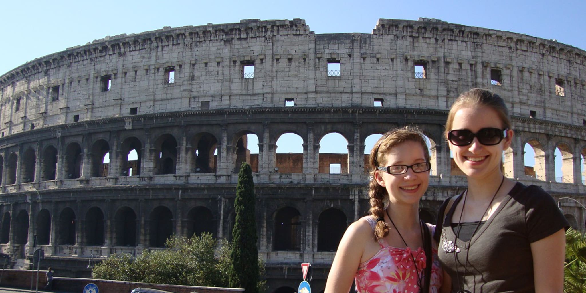 Mary Westerman and daughter pose for a picture in front of the Colosseum