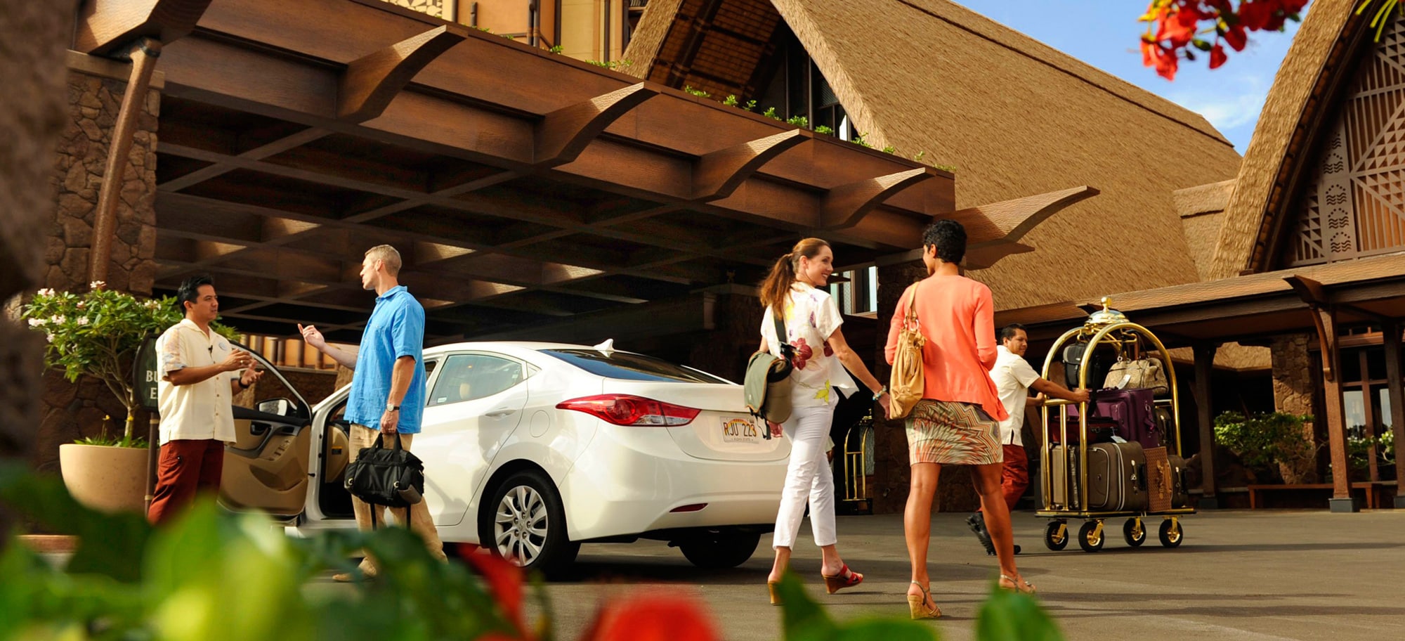 Guests using valet and bell services at Aulani