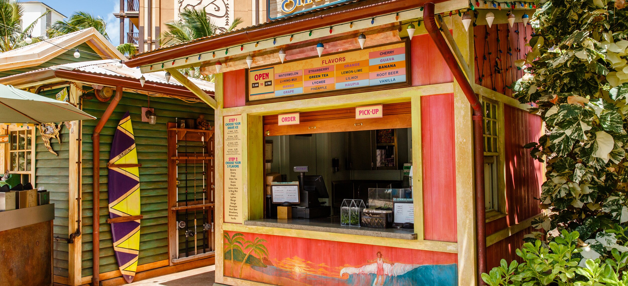 The exterior of Papalua Shave Ice, showing the menu board, ordering instructions and walk-up window