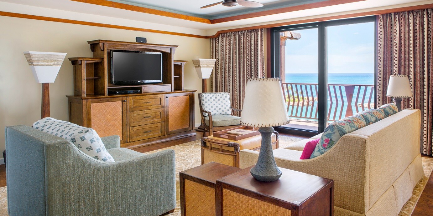 The living area and balcony of an oceanfront Villa at Aulani Resort