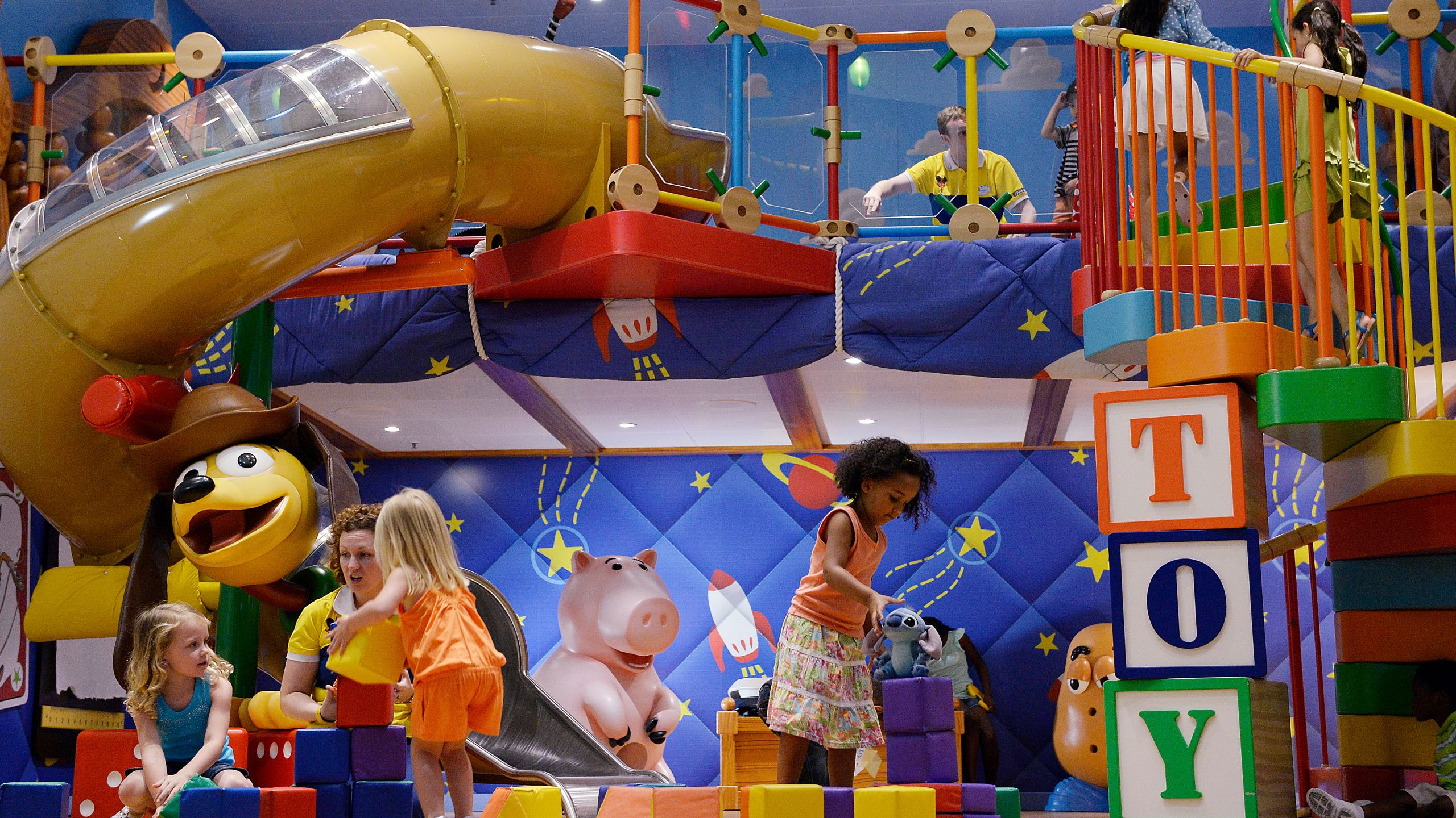 Children and Cast Members playing together in Andy's Room at Disney's Oceaneer Club