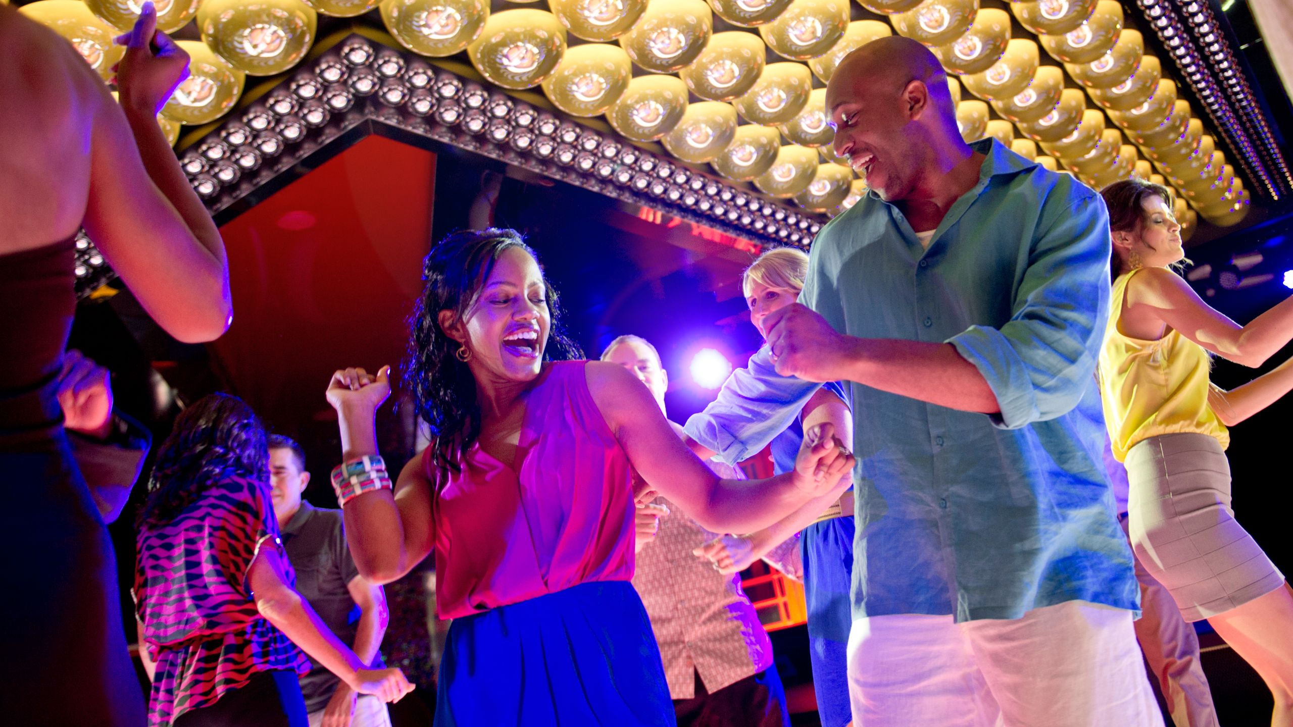 A young couple dancing in a night club