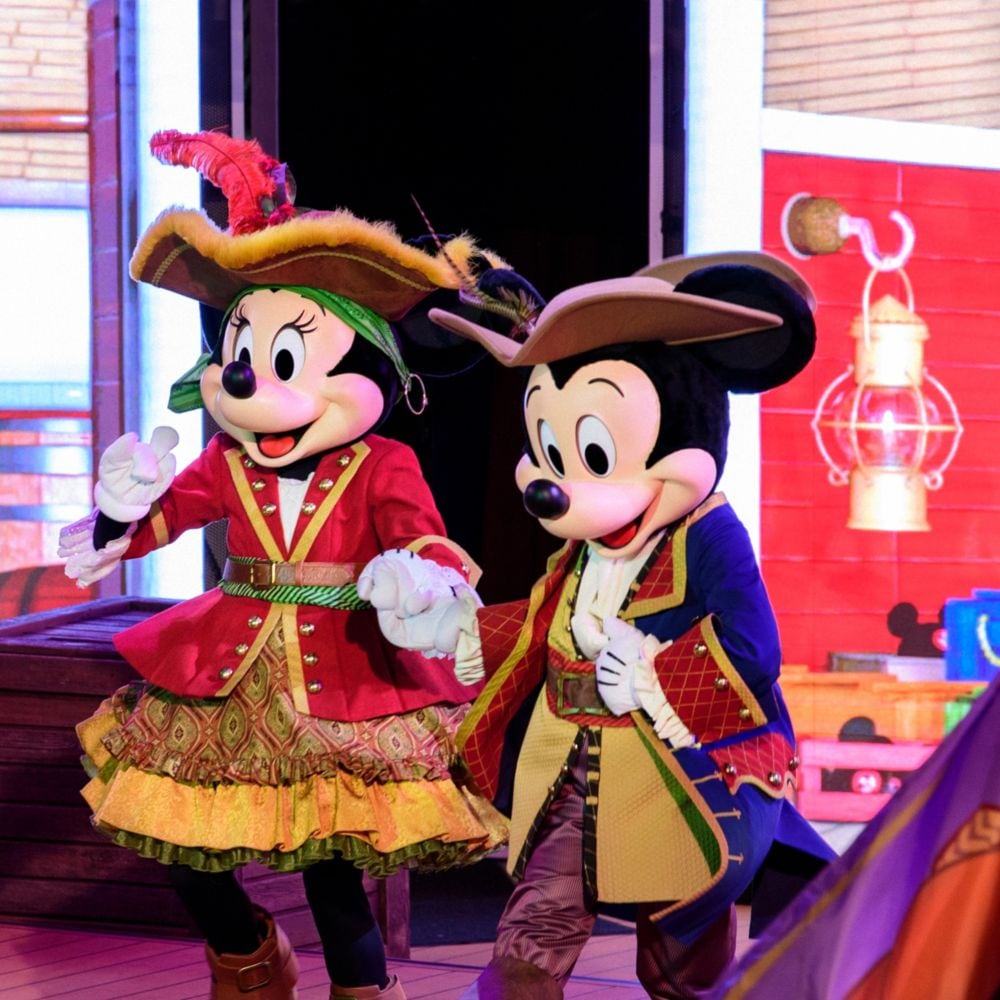 Minnie Mouse and Mickey Mouse wearing pirate outfits