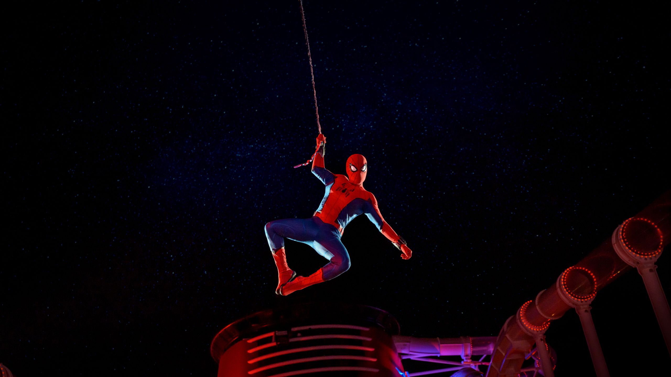 Spider Man performing his web swinging pose on the deck of a Disney Cruise Line ship during a Marvel Day at Sea event