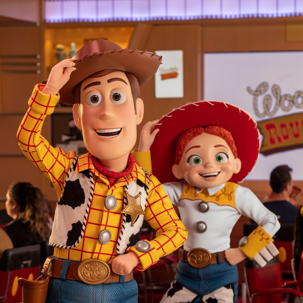 Woody and Jessie from ′Toy Story′ near Guests at Roundup Rodeo BBQ