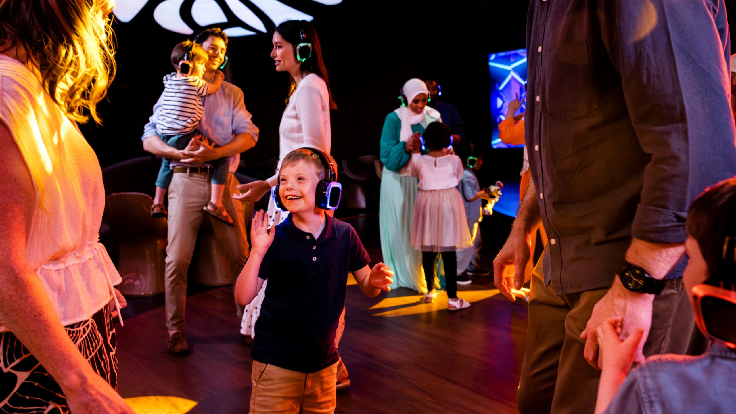 Adult and child Guests dancing while enjoying a silent disco at D Lounge