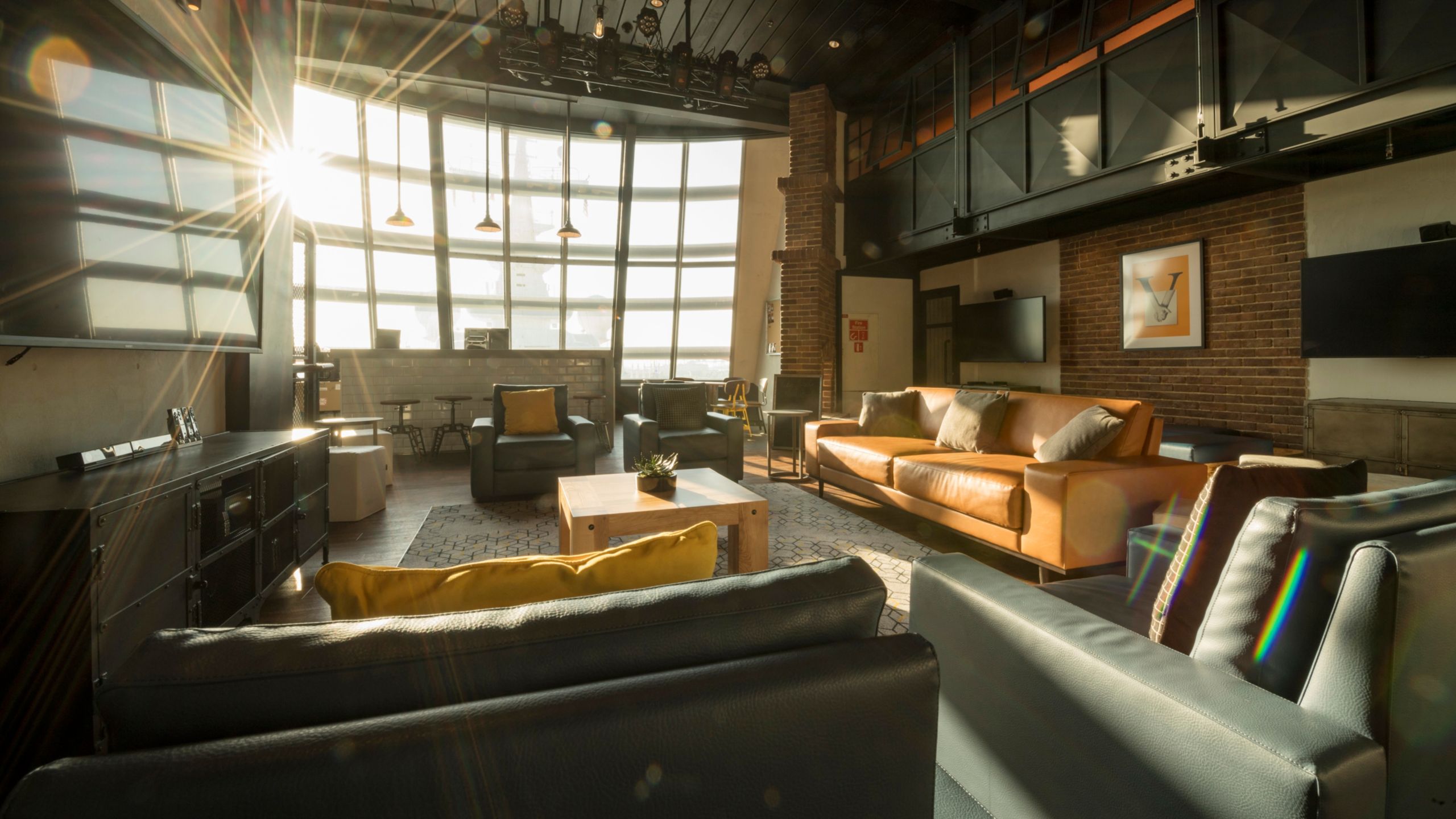 The Vibe teenager youth club, with couches, chairs, TVs and windows