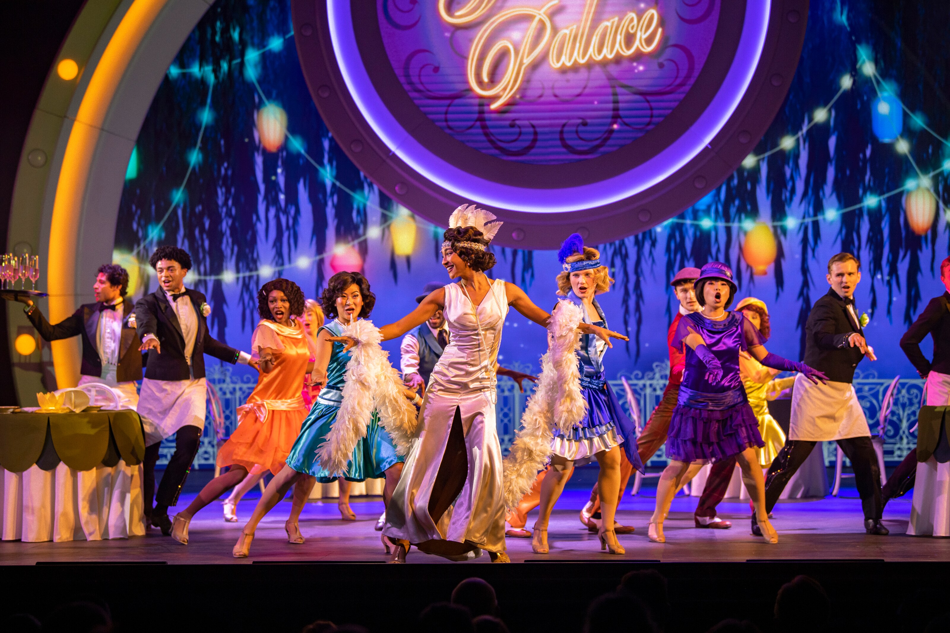 Princess Tiana and dancers performing on stage in Disney Seas the Adventure